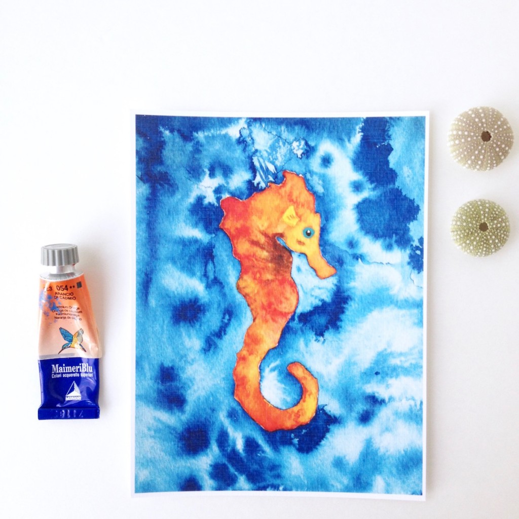 Orange Baby Seahorse on a blue watercolor background by Mika Harmony
