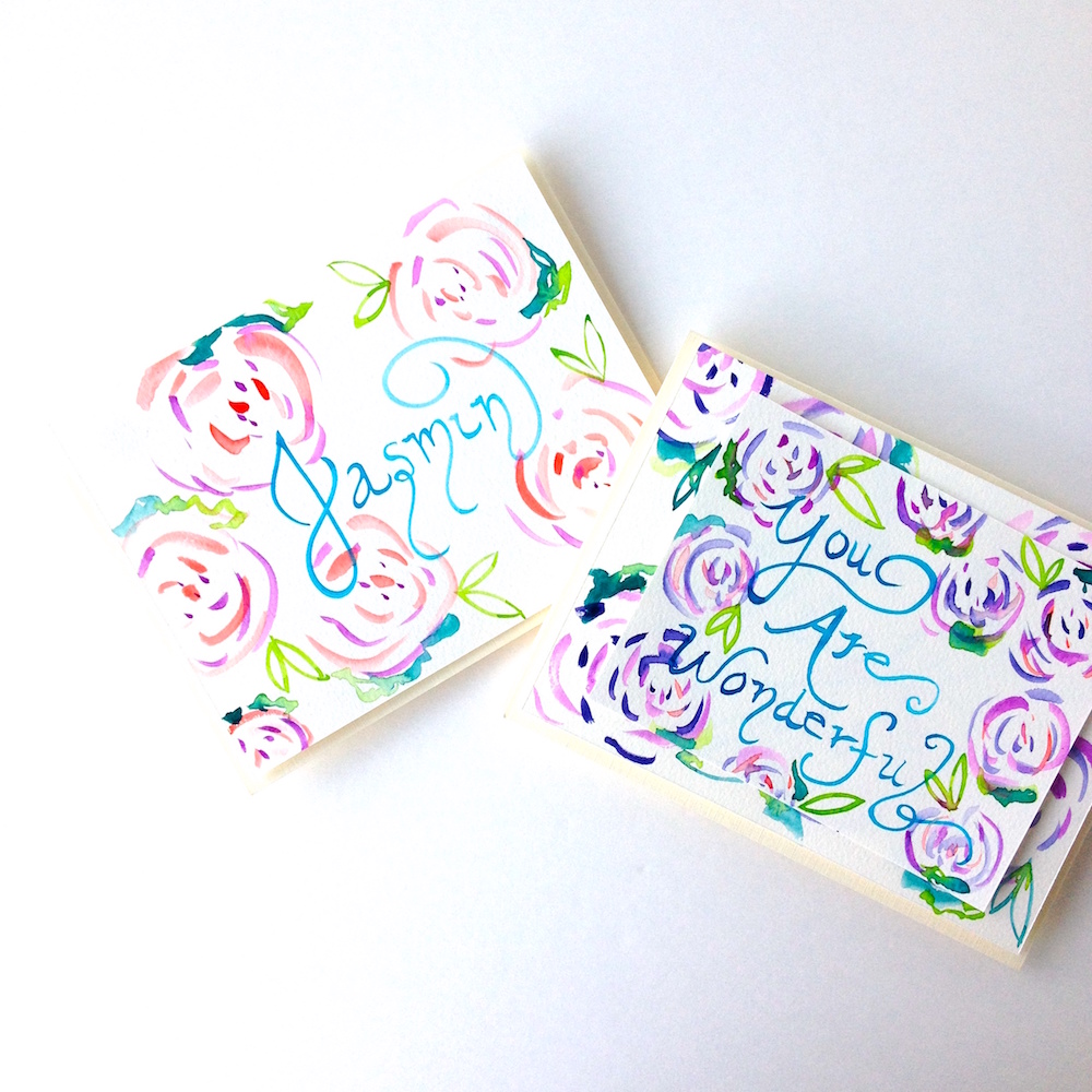 Watercolor roses handpainted cards on Mika Harmony's Art Studio desk